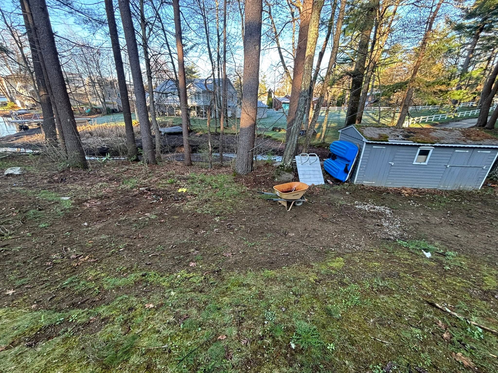 Old heaving concrete pad with poor drainage — before demolition
